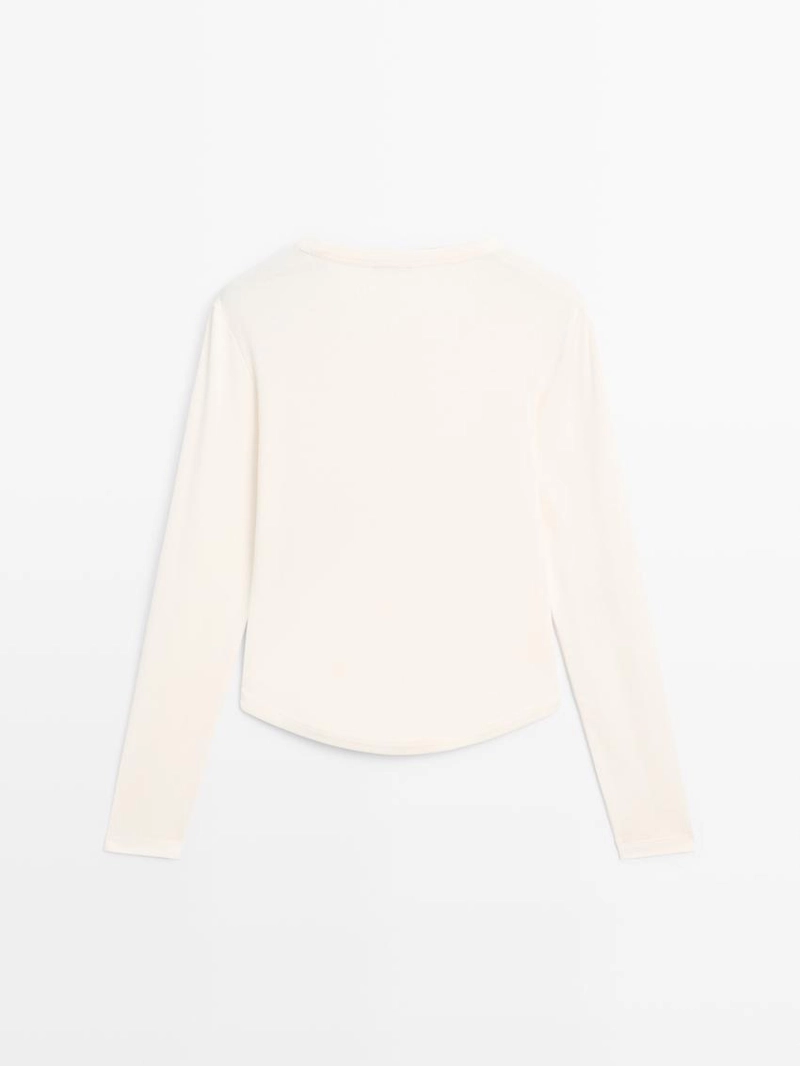 Футболка с длинным рукавом и закругленным подолом