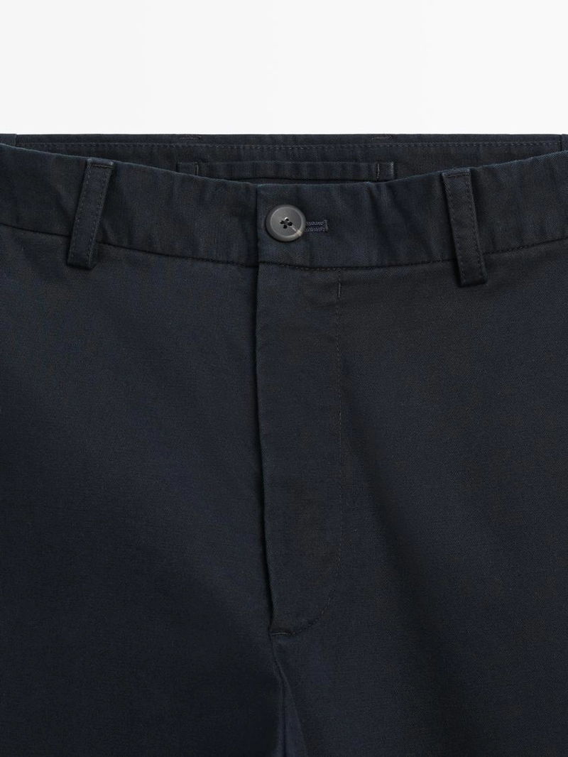 Брюки с зауженным кроем с эластичными вставками по бокам