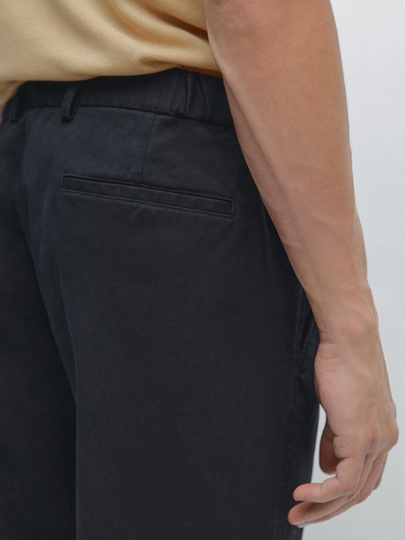 Брюки с зауженным кроем с эластичными вставками по бокам