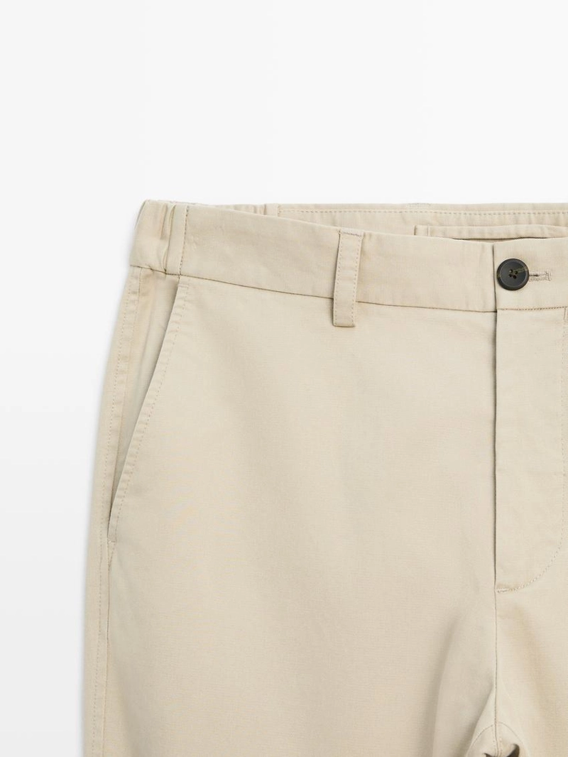 Брюки с зауженным кроем с эластичными вставками по бокам