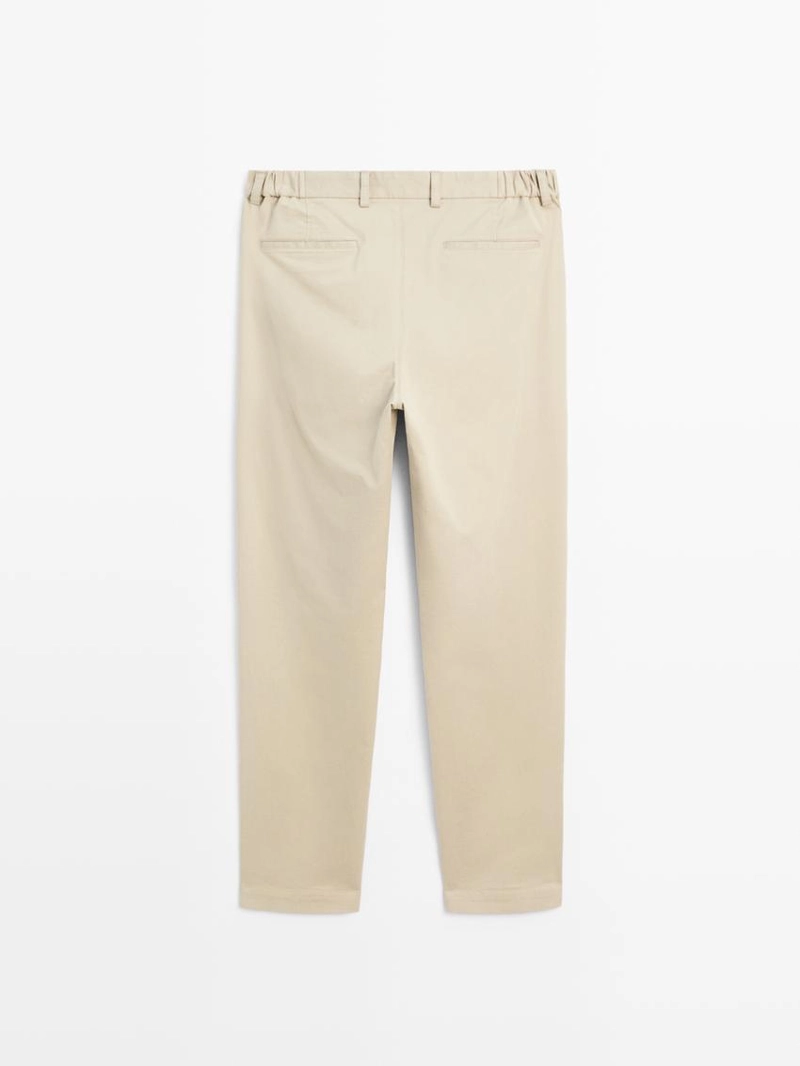 Брюки с зауженным кроем с эластичными вставками по бокам