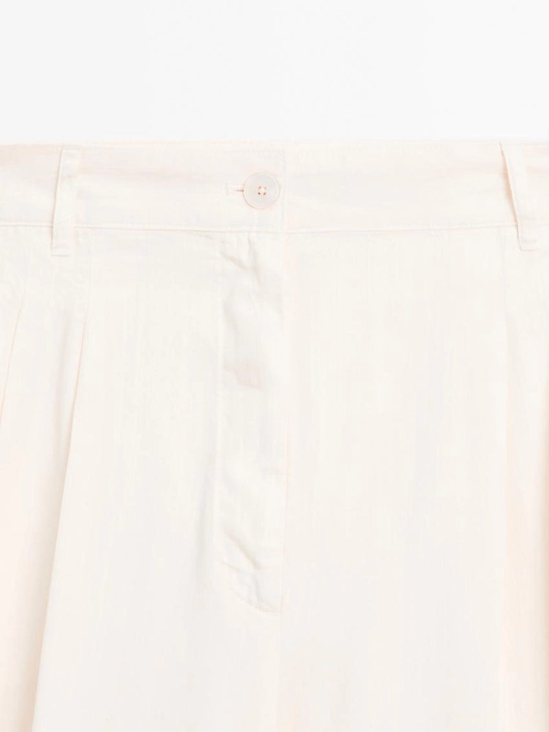 Брюки с широкими брючинами и двойными стрелками