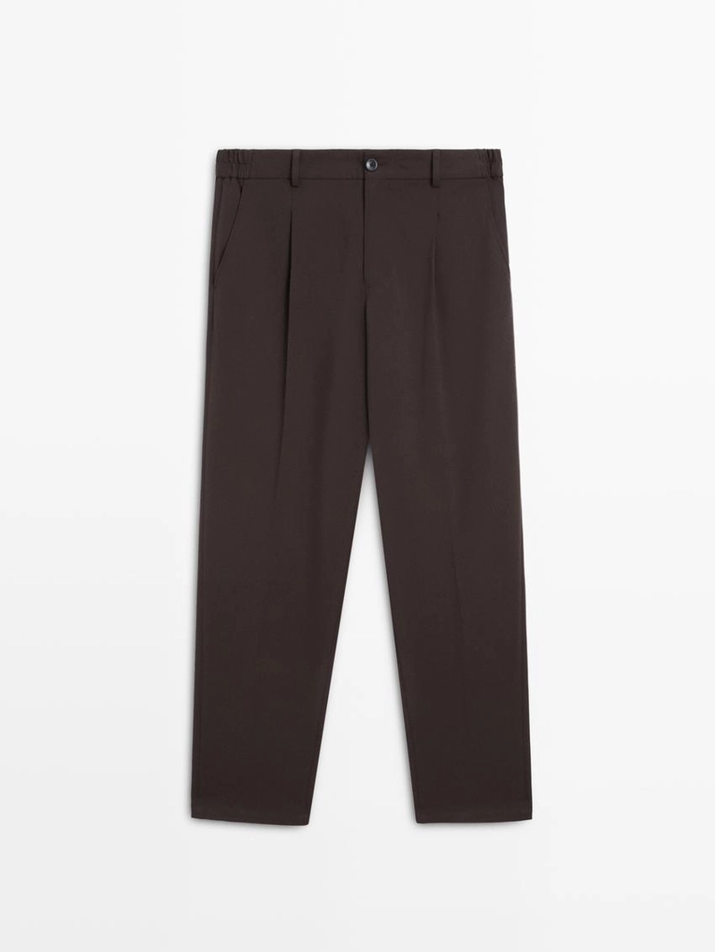 Брюки свободного кроя с защипами