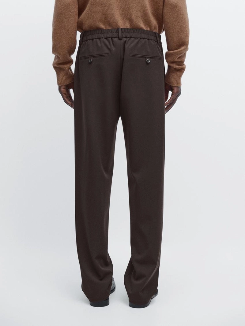 Брюки свободного кроя с защипами