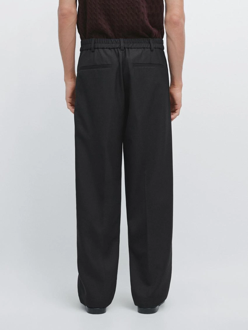 Брюки из шерсти свободного кроя с защипами