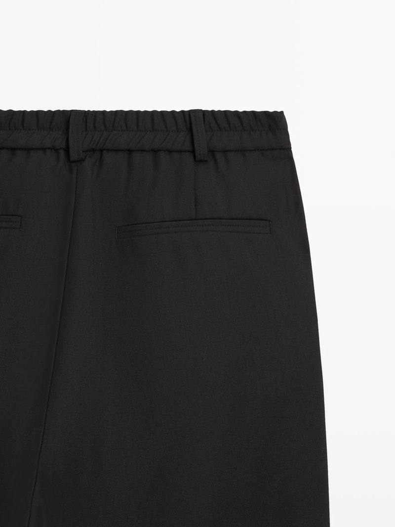 Брюки из шерсти свободного кроя с защипами