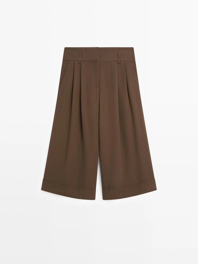 Длинные бермуды с подвернутыми краями