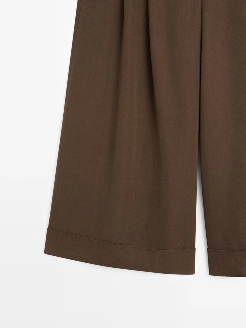 Длинные бермуды с подвернутыми краями