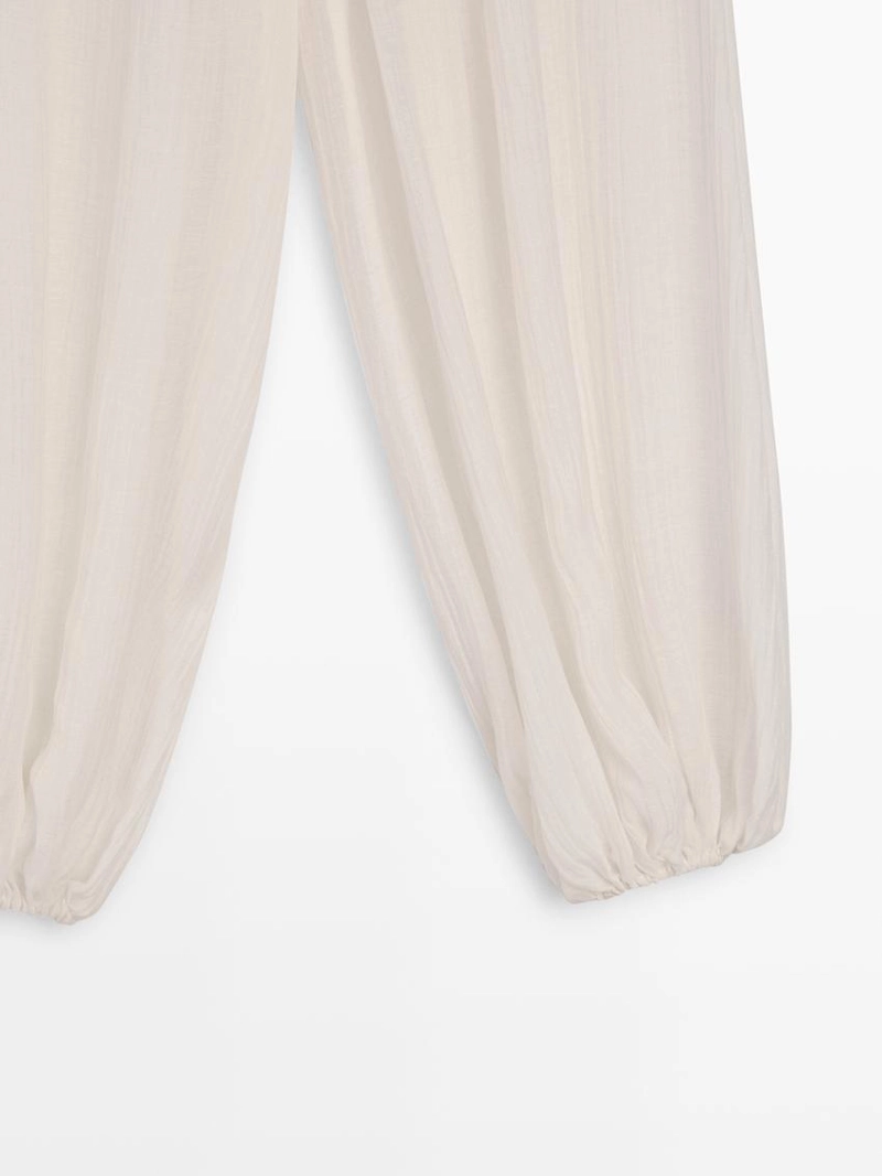 Брюки-саруэль flowing с деталями в складку