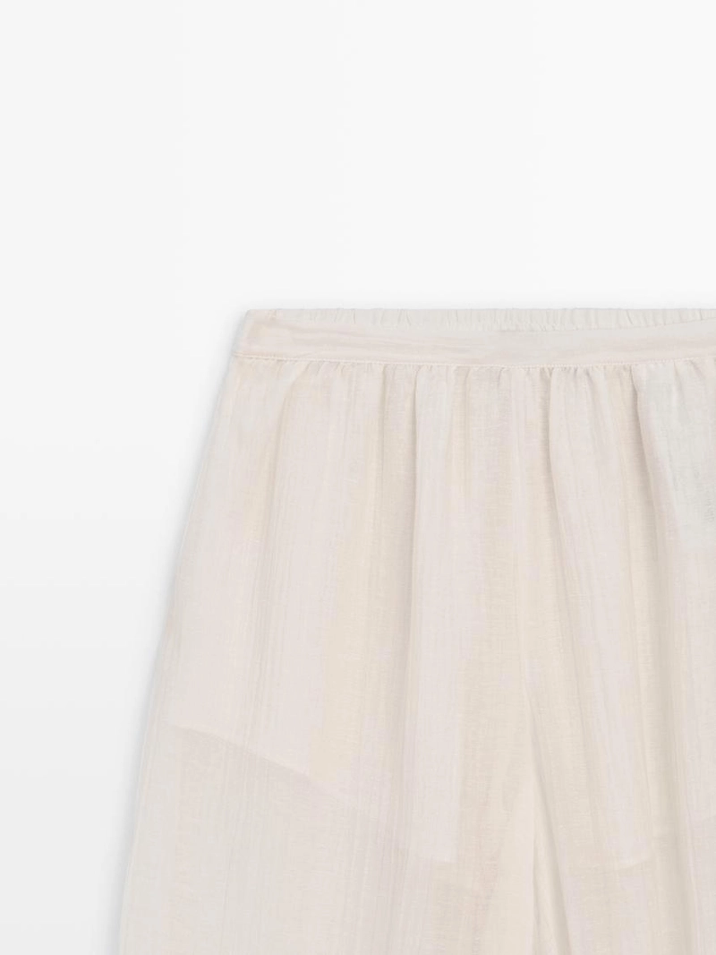 Брюки-саруэль flowing с деталями в складку