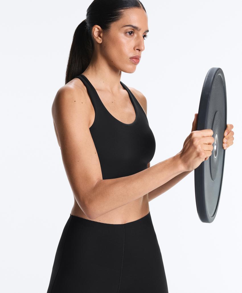 Compressive firm support cross-back sports bra