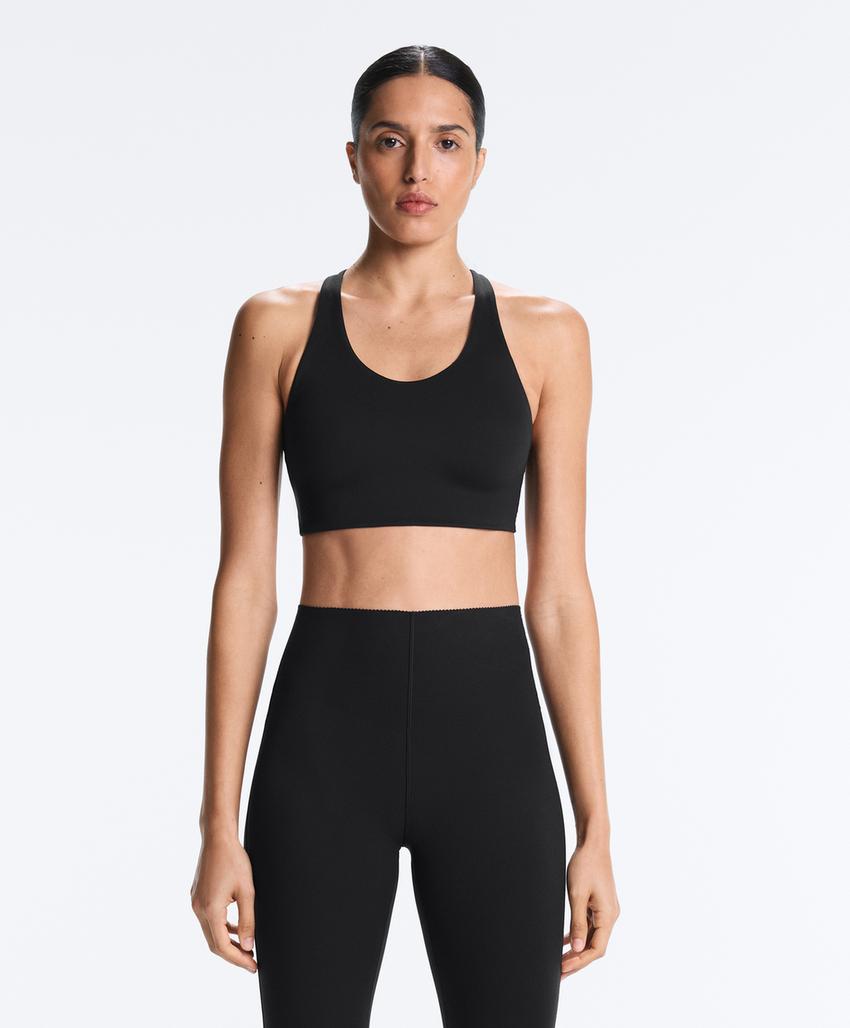 Compressive firm support cross-back sports bra