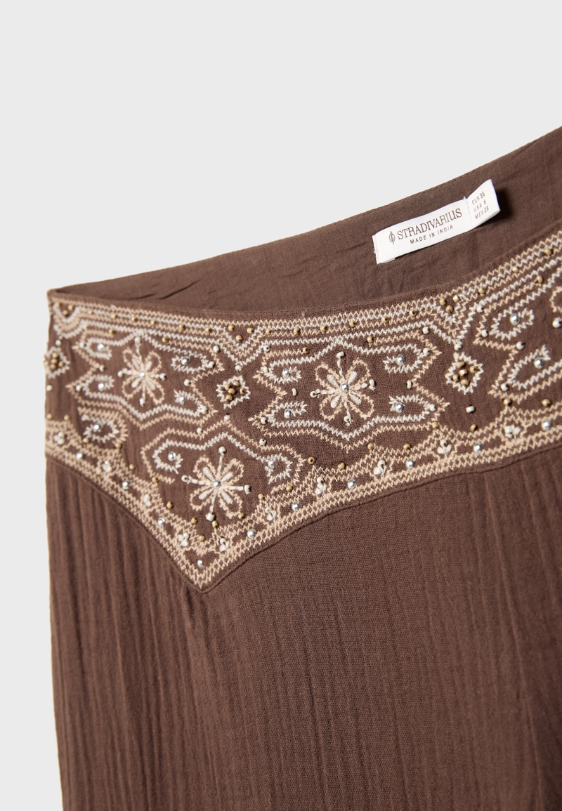 Брюки свободного кроя с рельефной вышивкой