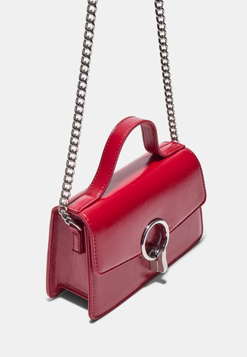 Сумка с плечевым ремнем и круглой застежкой