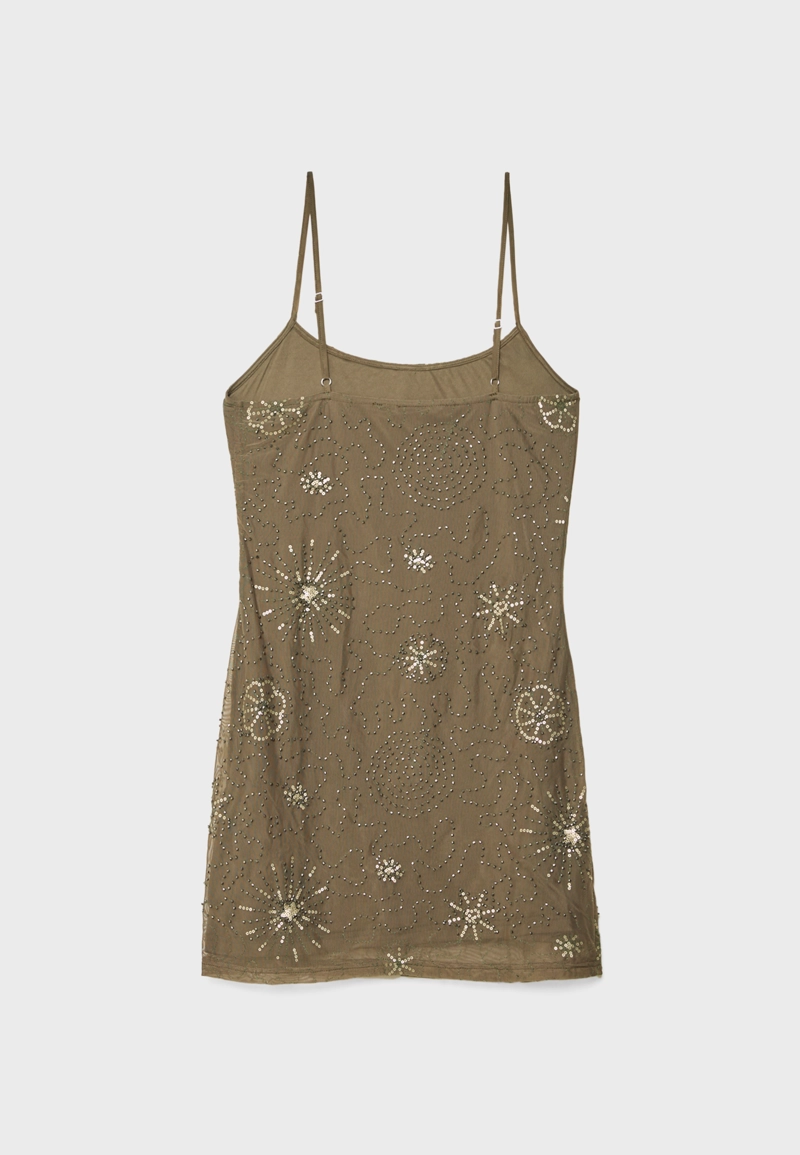 Короткое платье из полупрозрачной ткани с блестящей отделкой