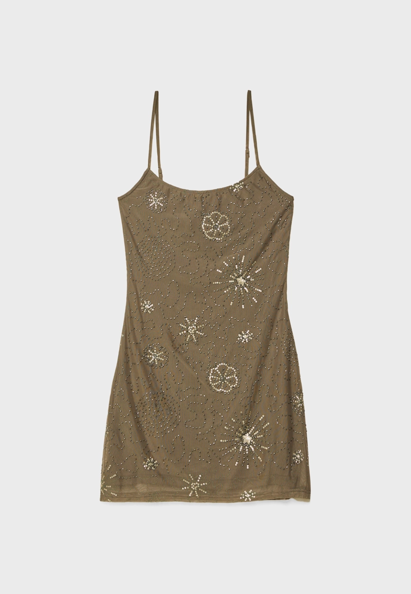 Короткое платье из полупрозрачной ткани с блестящей отделкой