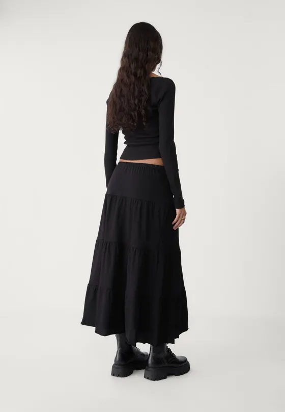 Длинная трикотажная юбка свободного кроя