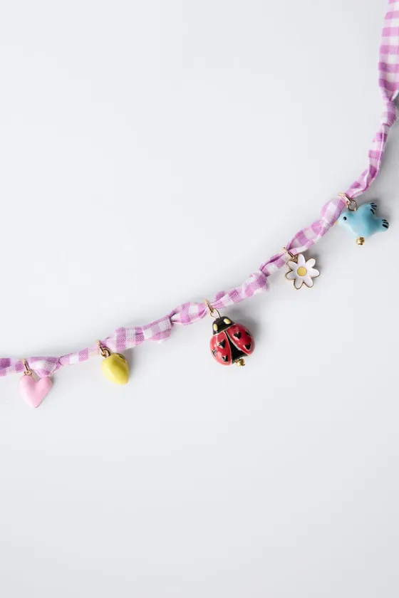 Ожерелье с клетчатым узором и бисером