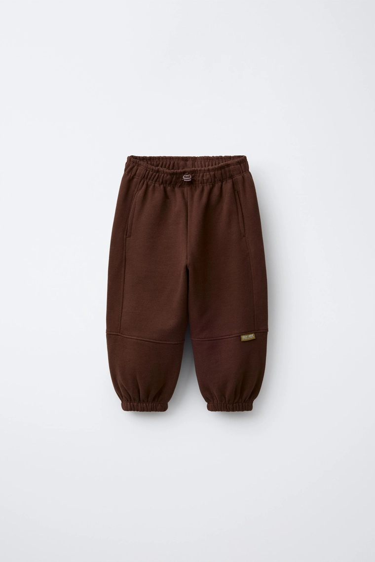 БРЮКИ-ДЖОГГЕРЫ С НАШИВКОЙ