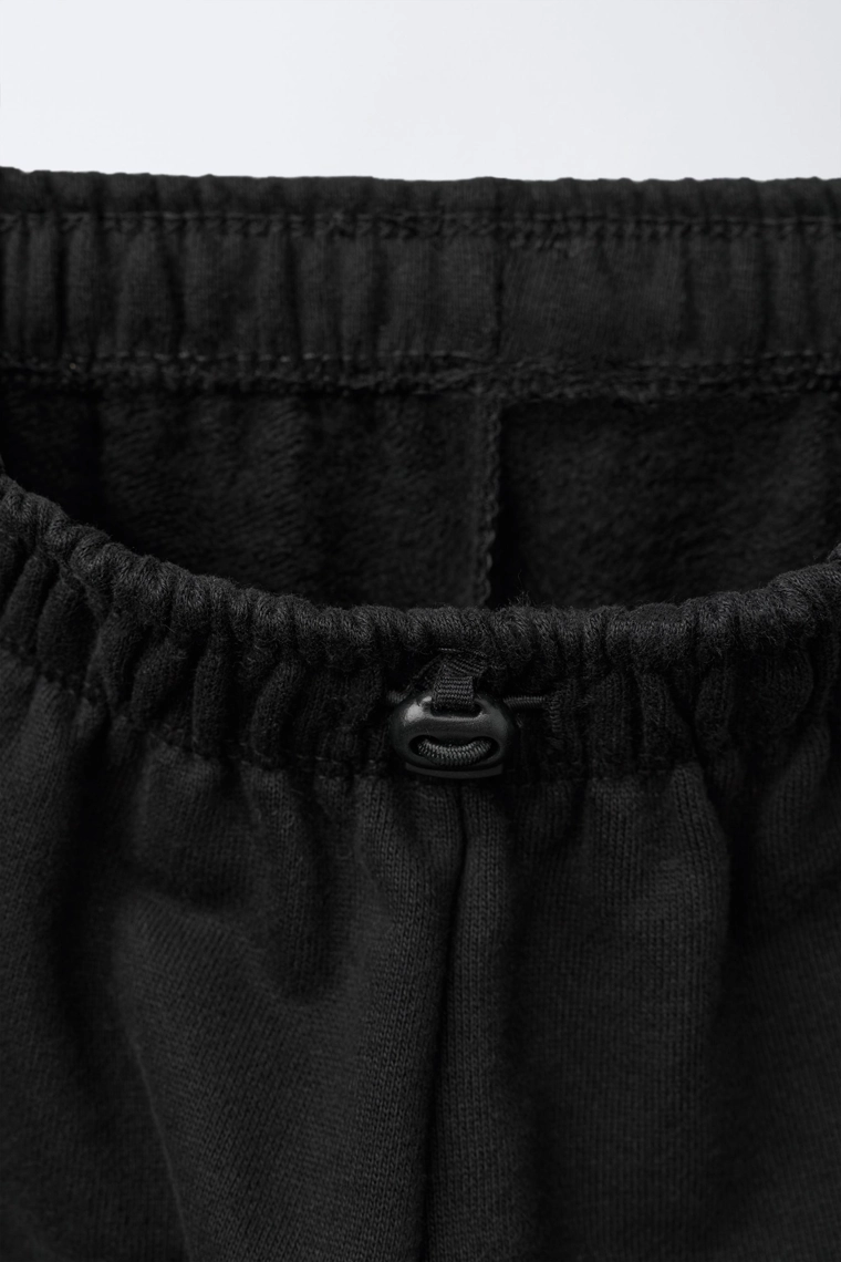 БРЮКИ-ДЖОГГЕРЫ С НАШИВКОЙ