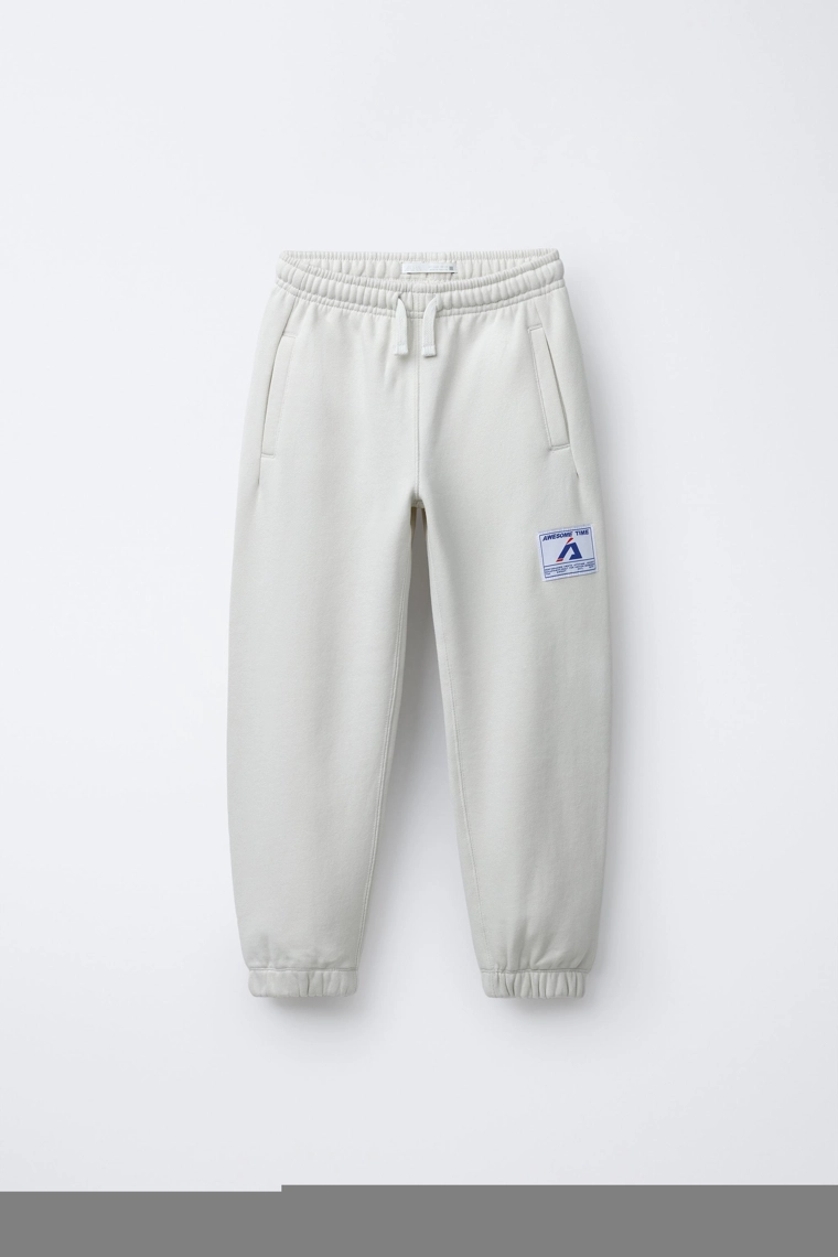 БРЮКИ-ДЖОГГЕРЫ С ЭТИКЕТКОЙ