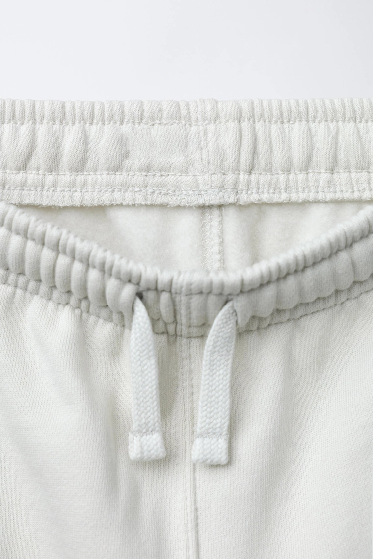 БРЮКИ-ДЖОГГЕРЫ С ЭТИКЕТКОЙ