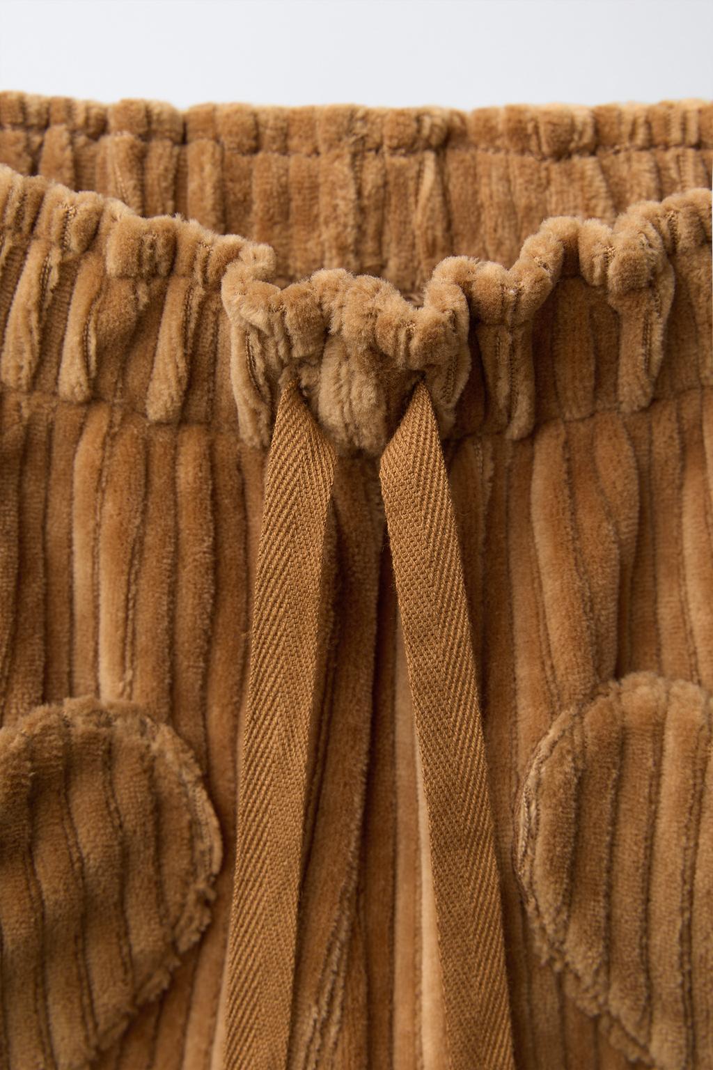 Широкие брюки из вельвета с карманами в форме сердец