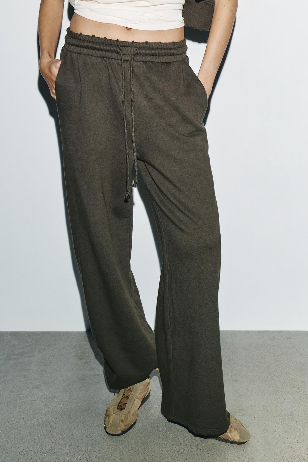 БРЮКИ С ЭФФЕКТОМ ПОТЕРТОСТИ, ЗВЕЗДАМИ И ЗАКЛЕПКАМИ