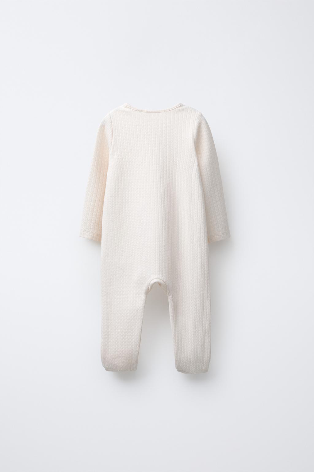 КОМБИНЕЗОН С РЕГУЛИРУЕМЫМИ ШТАНИНАМИ И V-ОБРАЗНЫМ ВЫРЕЗОМ