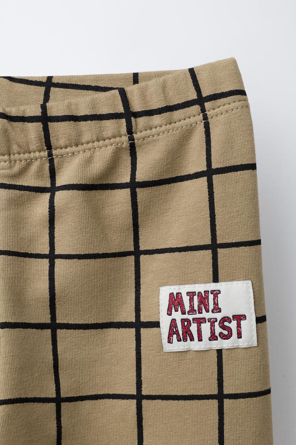 ЛЕГИНСЫ В КЛЕТКУ С ЭТИКЕТКОЙ