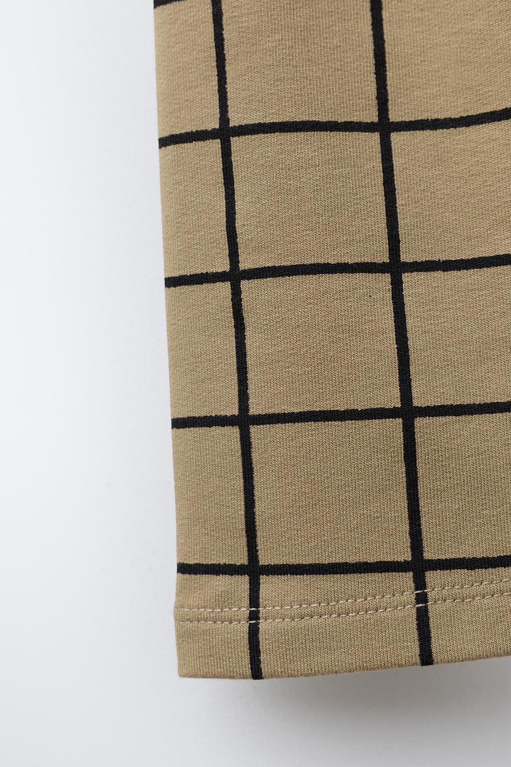 ЛЕГИНСЫ В КЛЕТКУ С ЭТИКЕТКОЙ