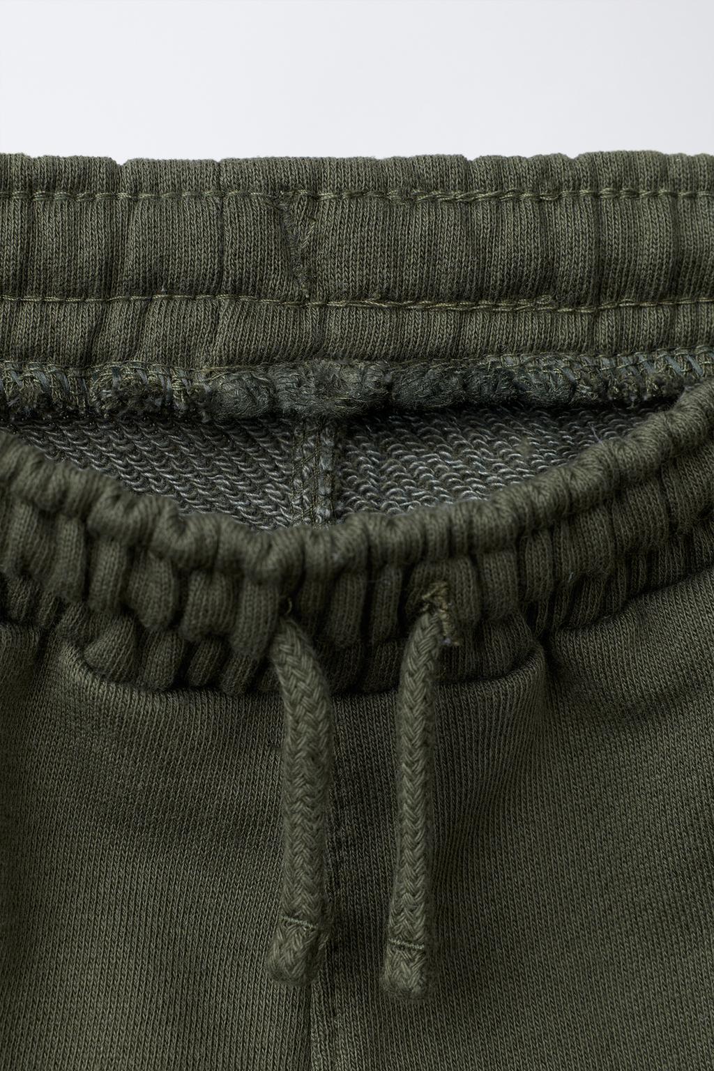 БРЮКИ-ДЖОГГЕРЫ С ЭТИКЕТКОЙ