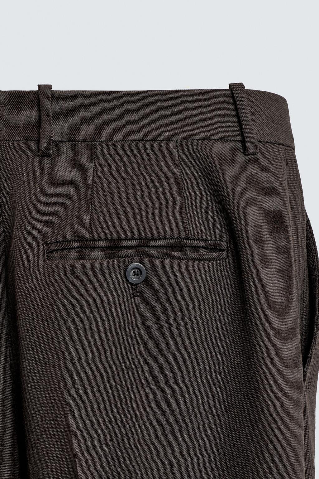 БРЮКИ ИЗ 100% ШЕРСТИ С ЗАЩИПАМИ