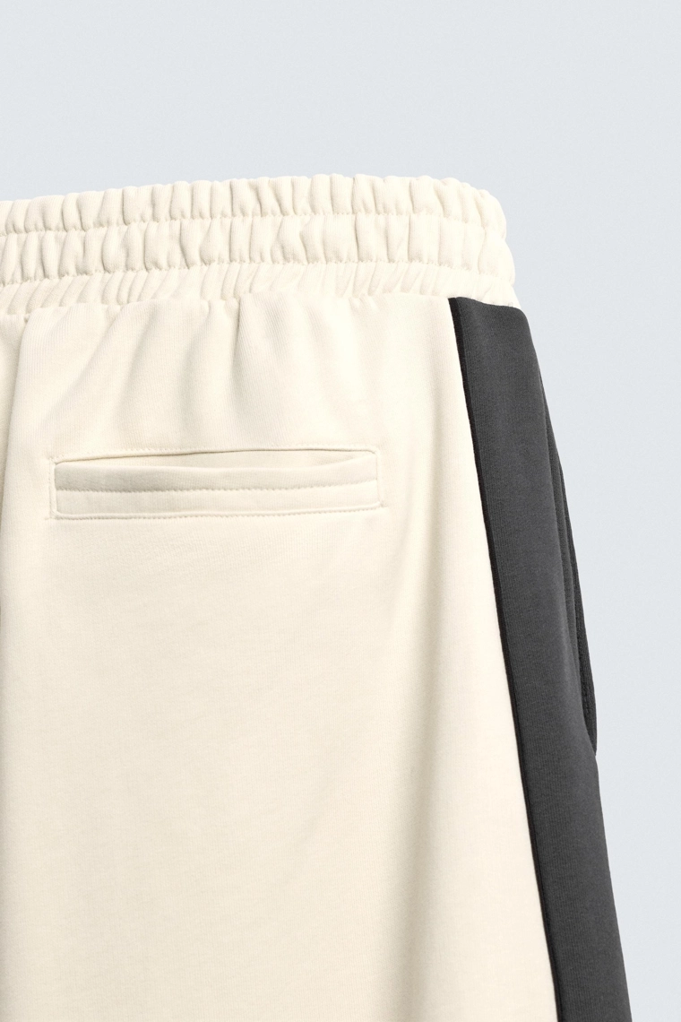 Брюки с манжетами и полосой по бокам