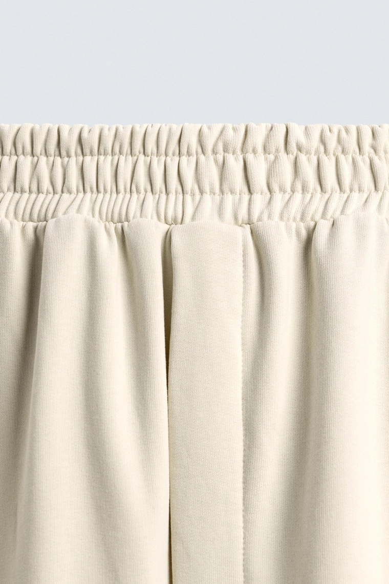 Брюки с манжетами и полосой по бокам