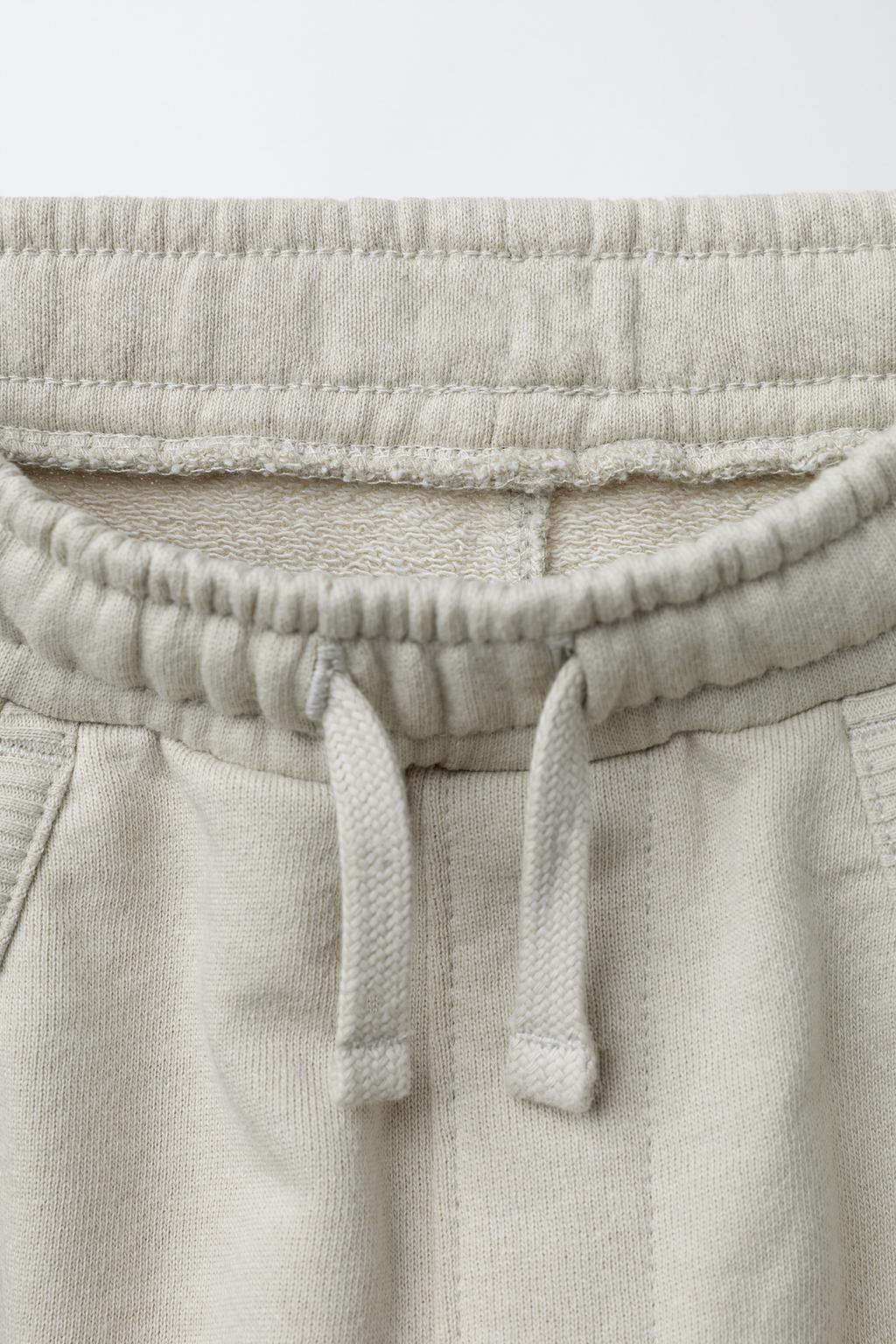 БРЮКИ-ДЖОГГЕРЫ ИЗ КОМБИНИРОВАННОЙ ТКАНИ