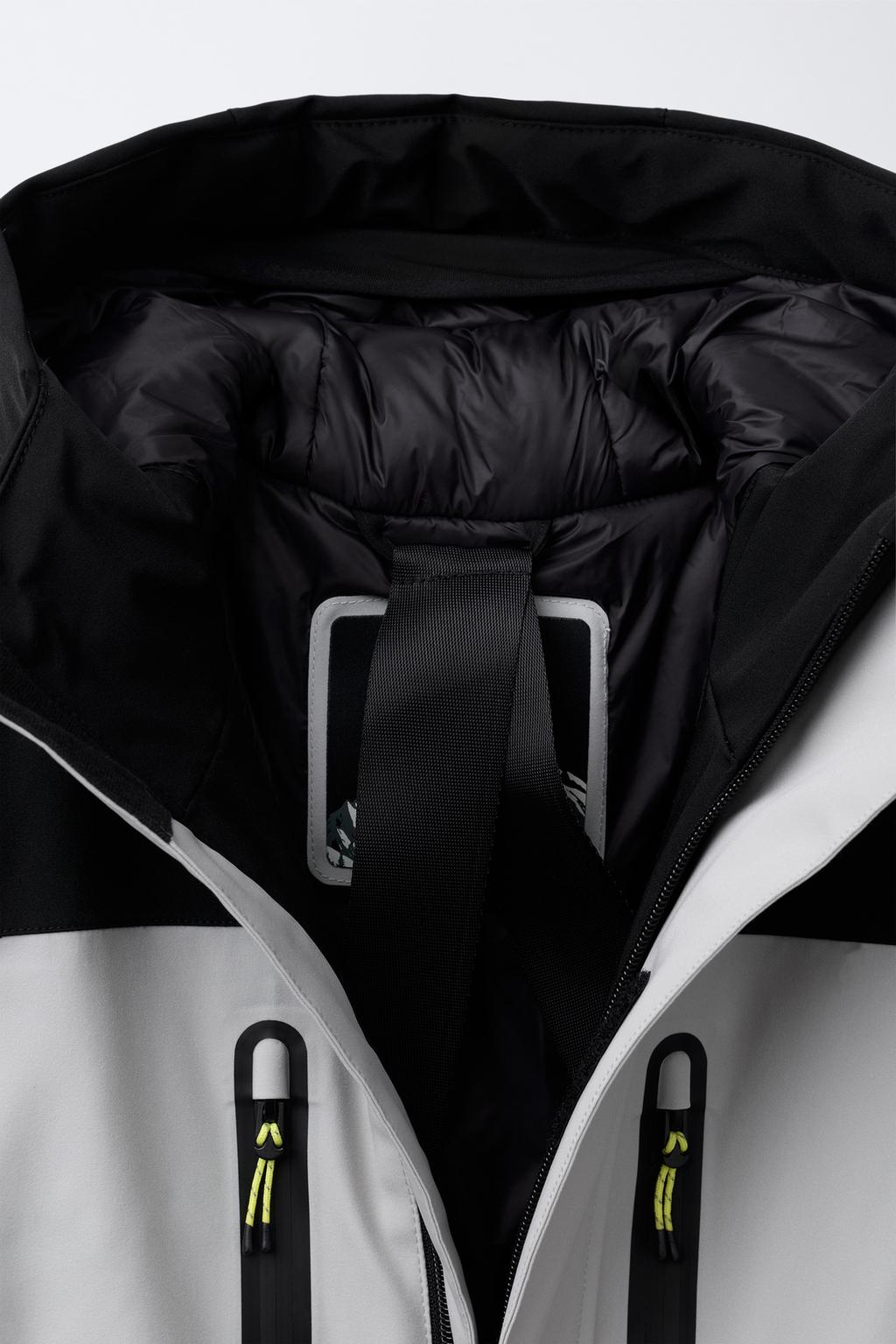 WINDPROOF AND WATER-RESISTANT HOODED JUMPSUIT RECCO® SYSTEM SKI COLLECTION