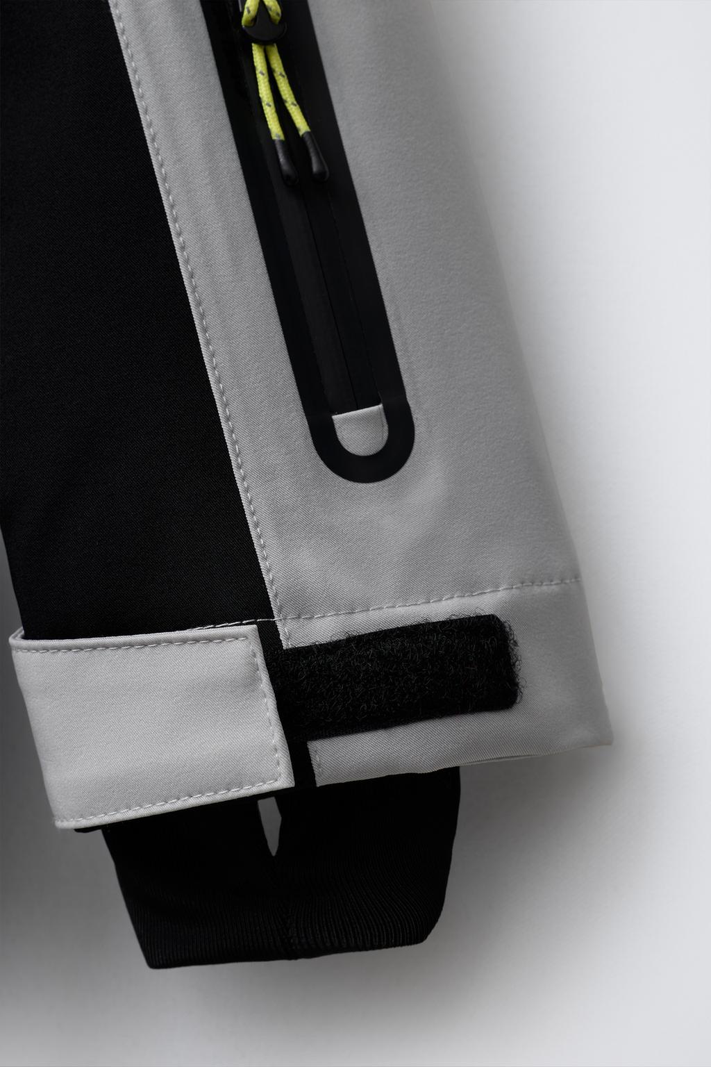 WINDPROOF AND WATER-RESISTANT HOODED JUMPSUIT RECCO® SYSTEM SKI COLLECTION