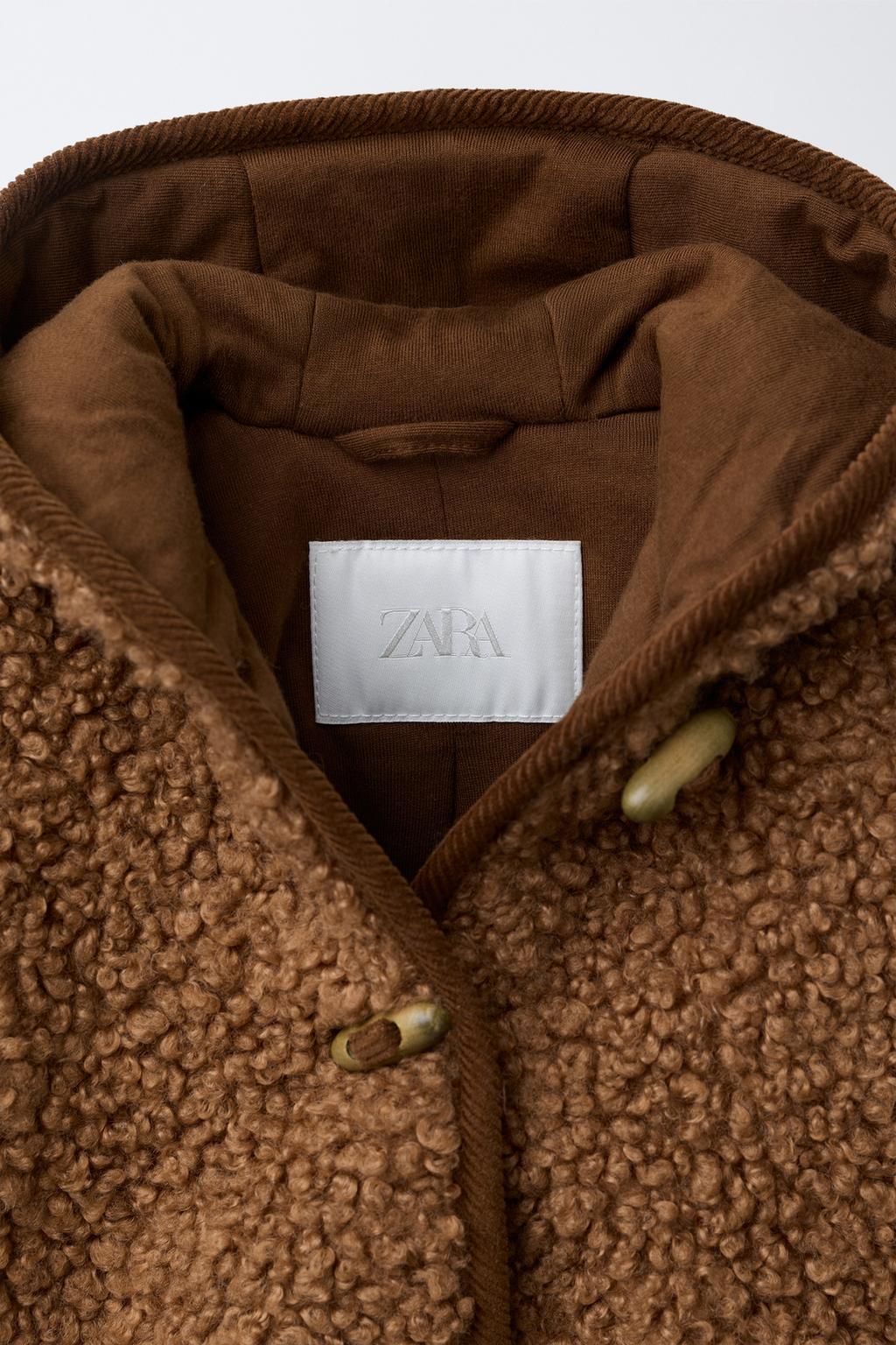 КУРТКА ИЗ ИСКУССТВЕННОЙ ОВЧИНЫ С НАВЕСНЫМИ ПЕТЛЯМИ