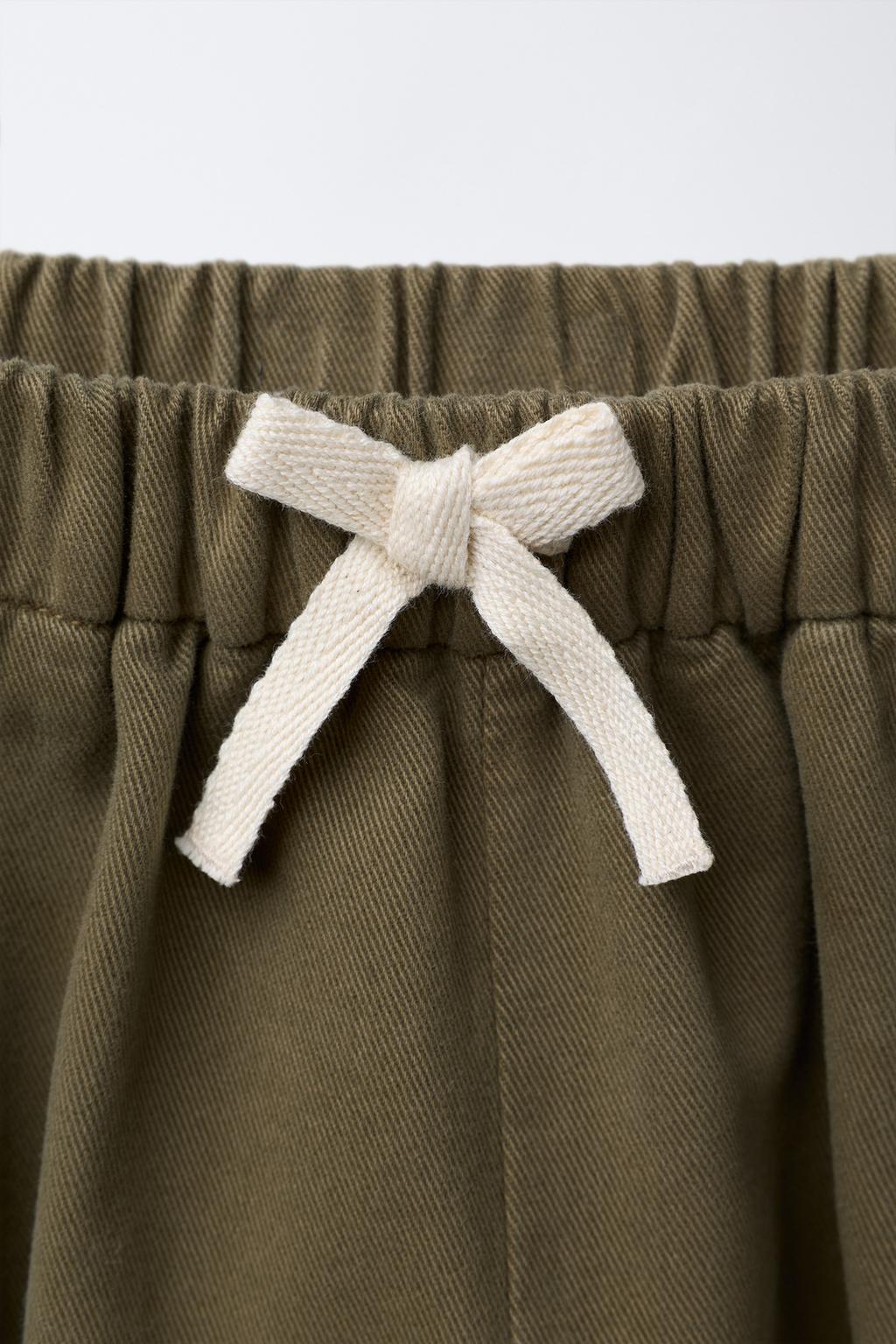 БРЮКИ БАГГИ С ЗАЩИПАМИ