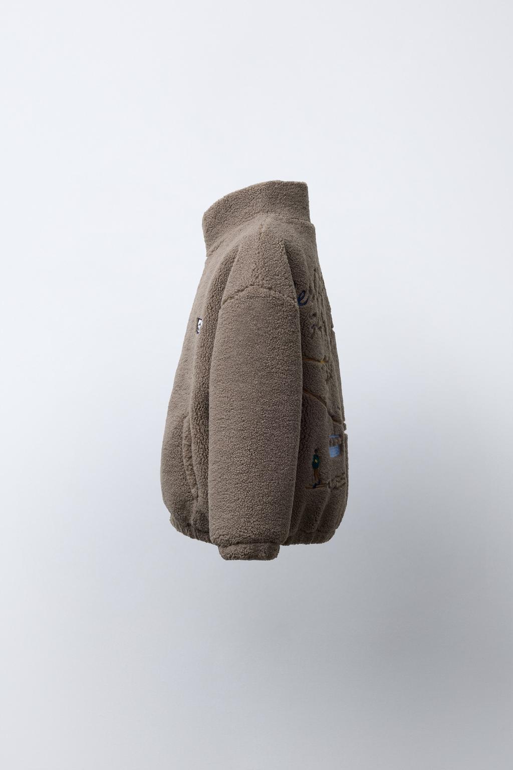 КУРТКА ИЗ ИСКУССТВЕННОЙ ОВЧИНЫ С ВЫШИВКОЙ