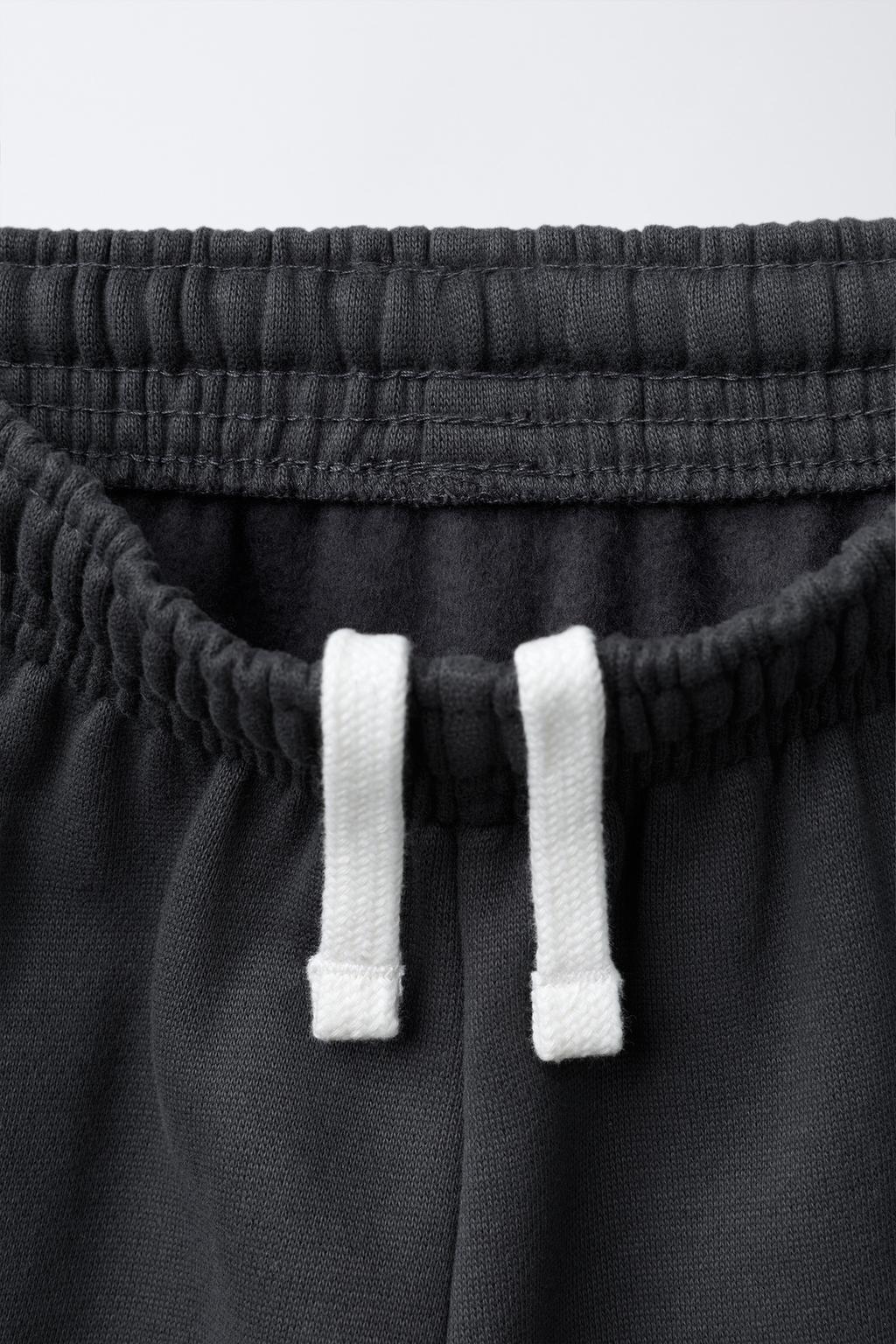 БРЮКИ-ДЖОГГЕРЫ С ТЕКСТОВЫМ ПРИНТОМ