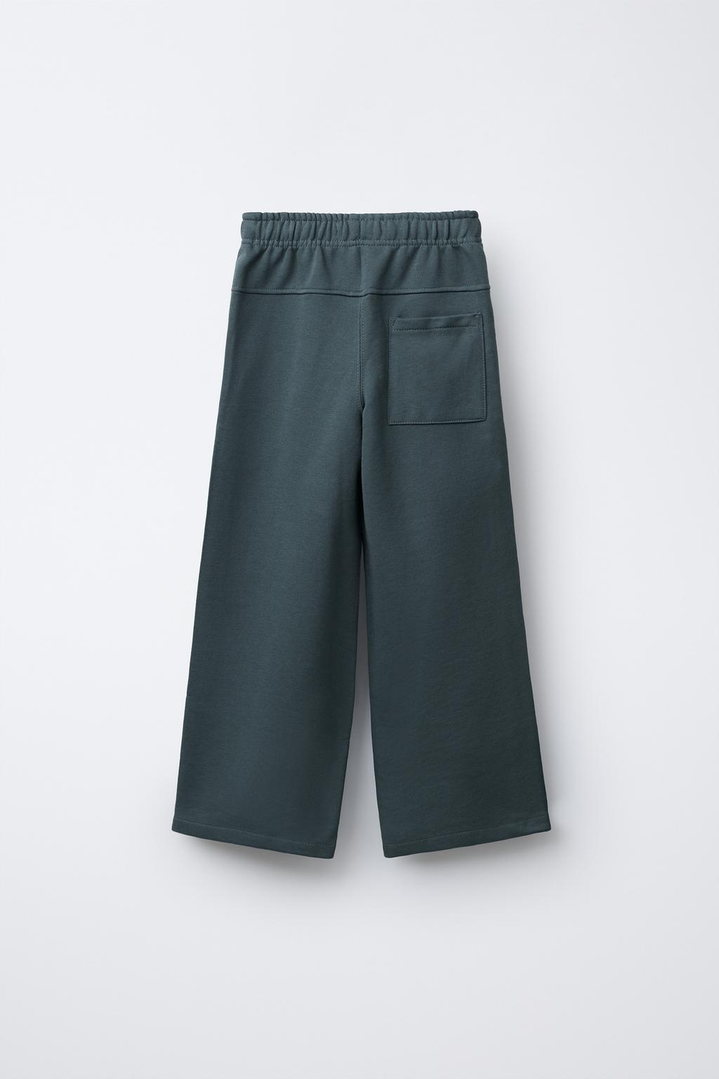 БРЮКИ ИЗ МЯГКОЙ ТКАНИ С НАШИВКОЙ