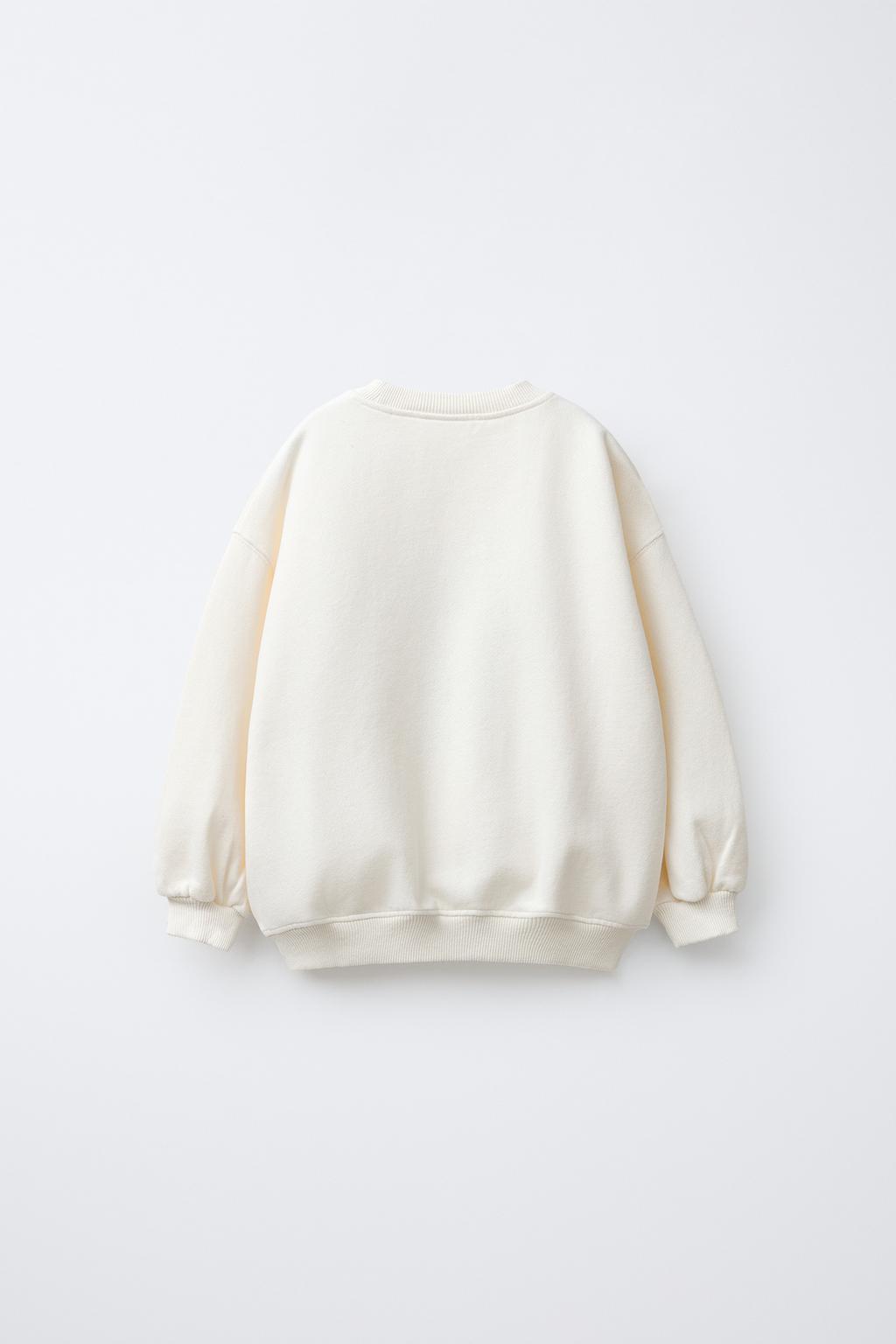 ТОЛСТОВКА С НАШИВКОЙ «ОЛЕНЬ» ИЗ ИСКУССТВЕННОЙ ОВЧИНЫ