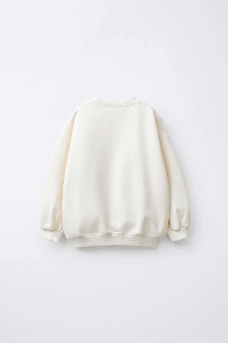 ТОЛСТОВКА С НАШИВКОЙ «ОЛЕНЬ» ИЗ ИСКУССТВЕННОЙ ОВЧИНЫ