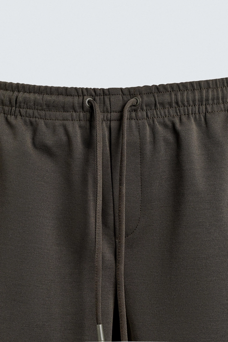 Комфортабельные брюки с манжетами на поясе без утюжки