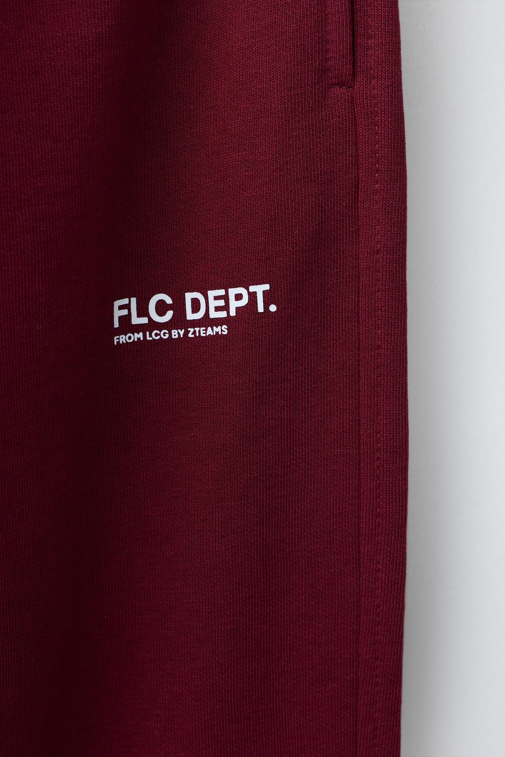 БРЮКИ-ДЖОГГЕРЫ ИЗ МЯГКОЙ ТКАНИ С ТЕКСТОМ