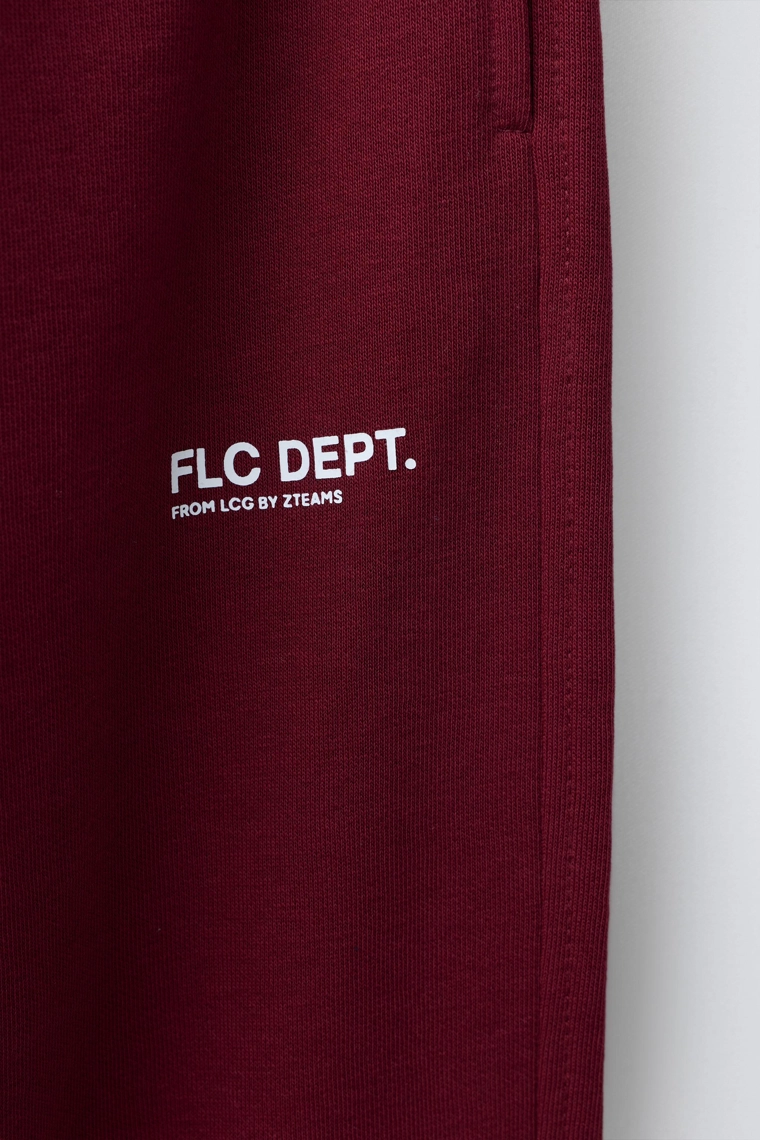 БРЮКИ-ДЖОГГЕРЫ ИЗ МЯГКОЙ ТКАНИ С ТЕКСТОМ