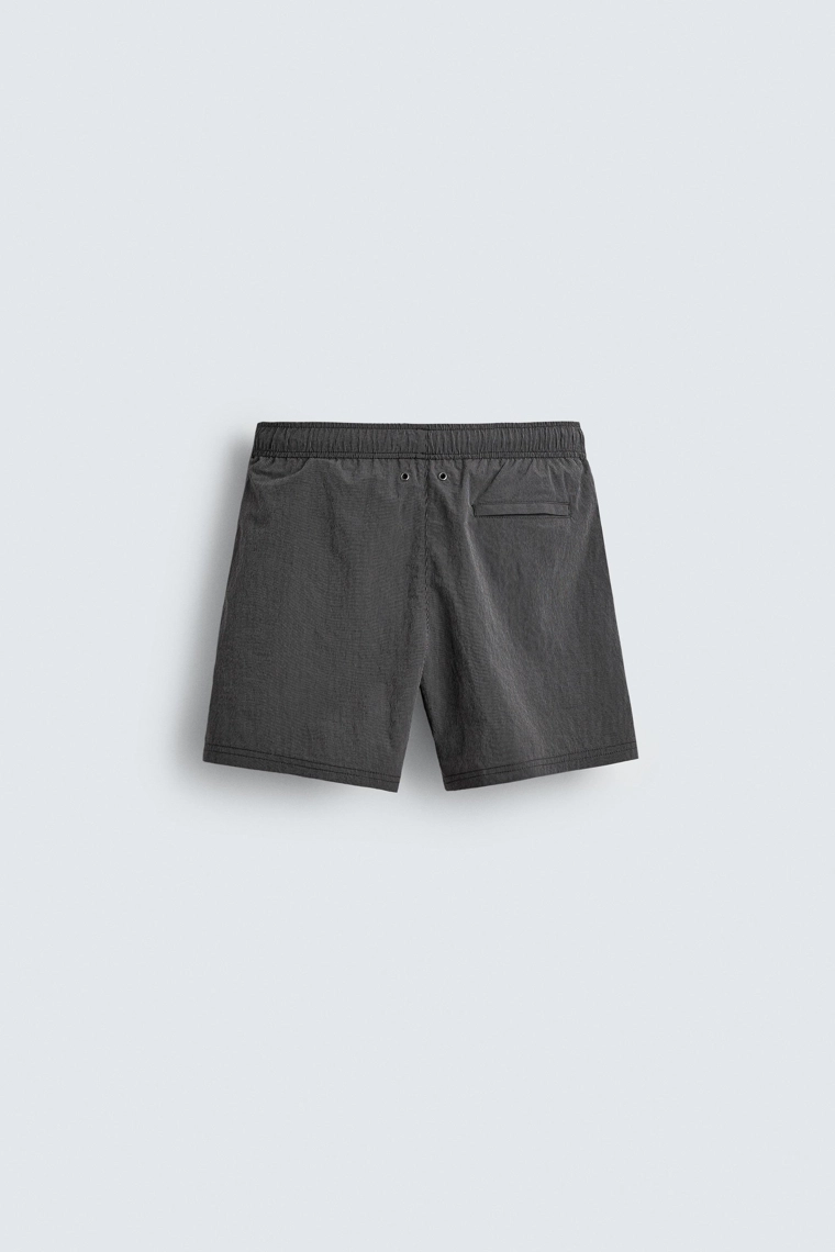 Полосатые плавательные трусы