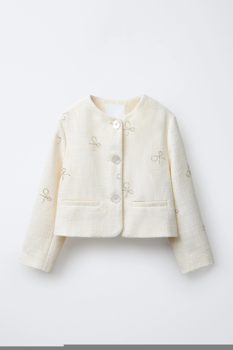 СТРУКТУРНЫЙ ЖАКЕТ С БАНТАМИ И БЛЕСТКАМИ